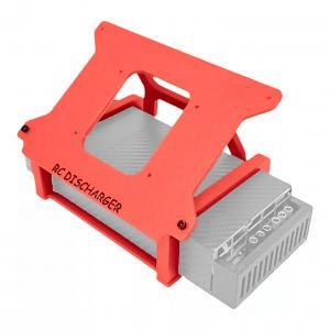 Red RC discharger mounting bracket on a gray electronic module, angled view on white background