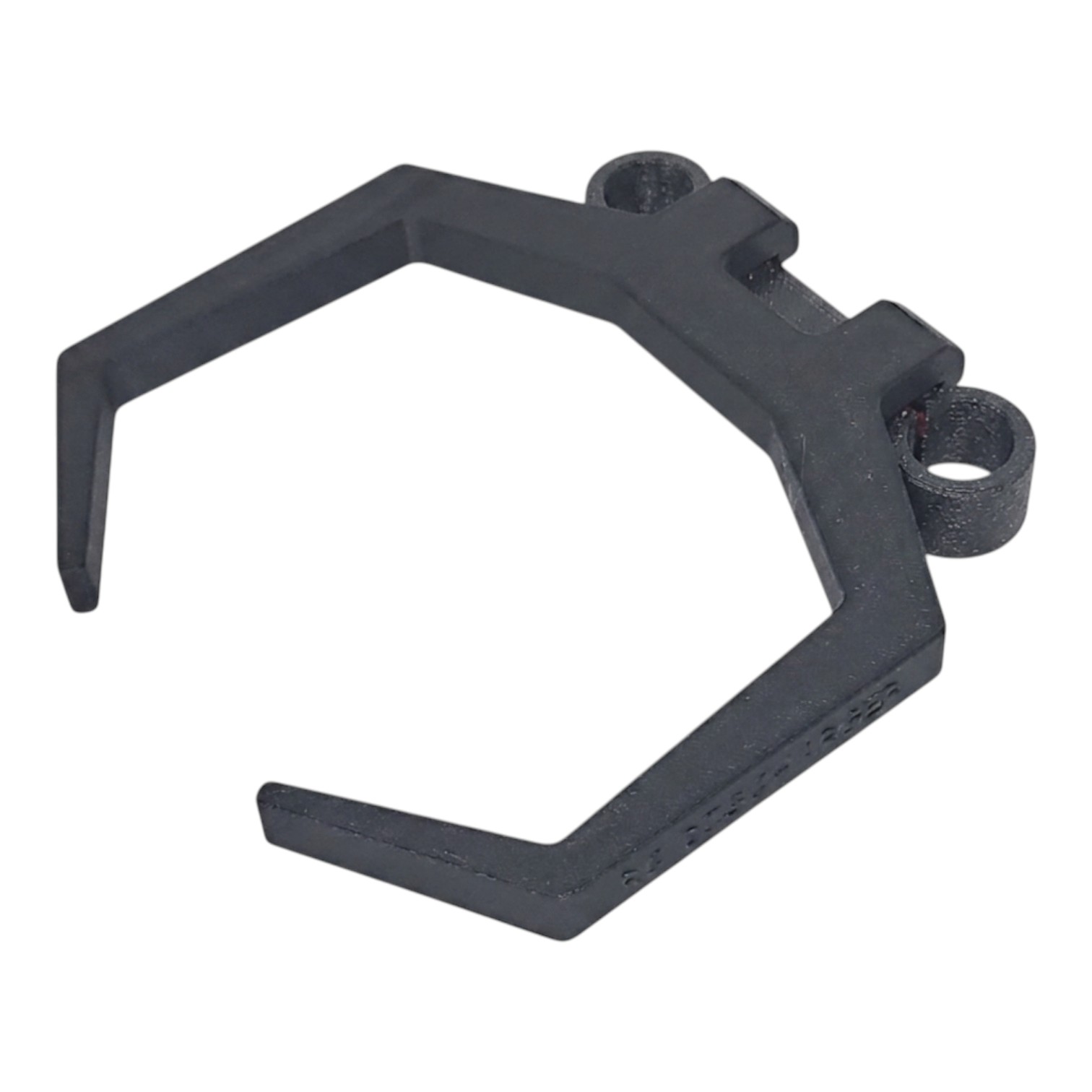 Black plastic hexagonal retaining clip with two mounting holes, isolated on white background