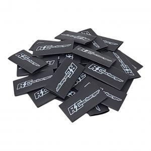 Pile of black RZ Discharger logo stickers on a white background