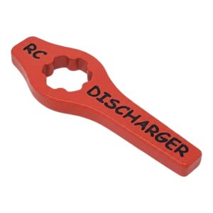 Red RC discharger tool with star-shaped center hole, used to discharge RC car capacitors, isolated on white background